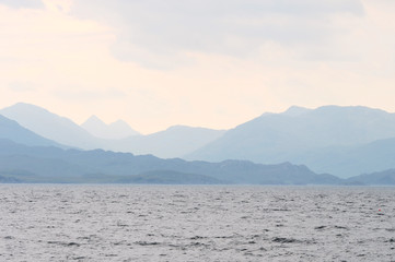 Mountains and sea in foggy weather in Scotland
