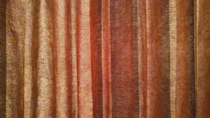 Curtain texture and sunlight from window.