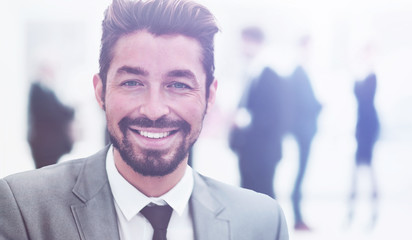 Handsome Business man in an office with blurred  background