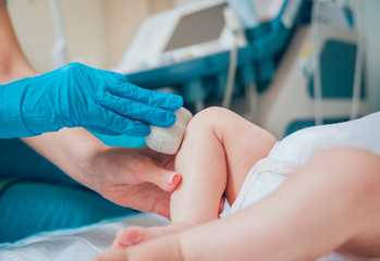 Doctor and little boy patient. Ultrasound equipment. Diagnostics. Sonography.