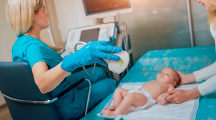 Obraz premium Doctor and little boy patient. Ultrasound equipment. Diagnostics. Sonography.
