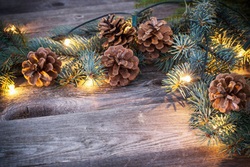 Christmas fir branches with cones and garland