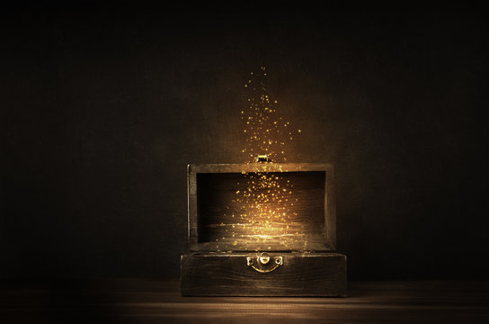 Opened Treasure Chest with Glowing Sparkles and Stars