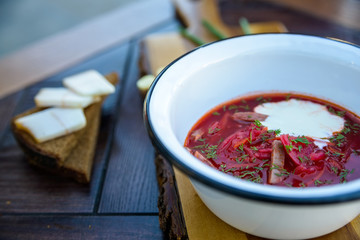 Ukrainian borscht soup and green onion on the table
