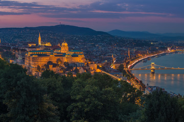 Budapest, Hungary - Colorful sunset at magic hour over Budapest with Buda Castle Royal Palace and famous Szechenyi Chain Bridge