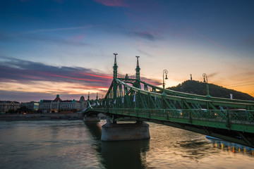 Budapest, Hungary - The beautiful Liberty Bridge at sunset with amazing colorful sky and clouds