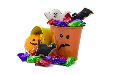 Fototapeta na wymiar Halloween concept - basket with candies and ccokies