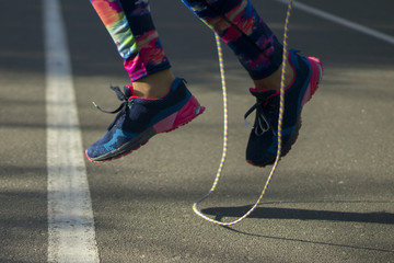 Fototapeta na wymiar Sport woman in park exercising outdoors fitness tracker wearable technology