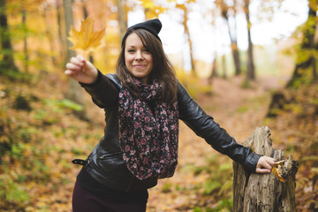 Portrait of cheerful young woman in autumn season