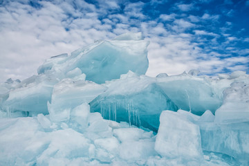 Fototapeta na wymiar Endless blue ice hummocks in winter on the frozen Lake Baikal