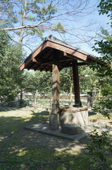 Beautiful old wooden well and outdoor scene on a sunny spring day
