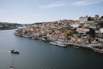 Fototapeta na wymiar Beautiful panoramic view on Porto's historic venter and Dom Luís I Bridge with river Douro