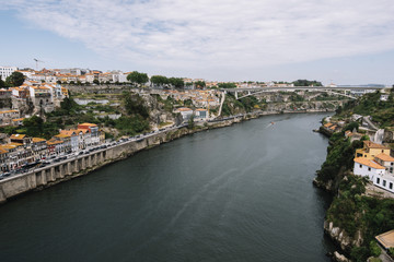 Fototapeta premium Beautiful panoramic view on Porto's historic venter and Dom Luís I Bridge with river Douro