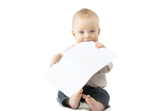 Infant child holding empty board, studio shot