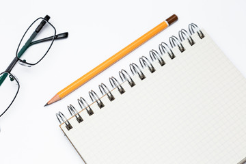 School notebook with glasses