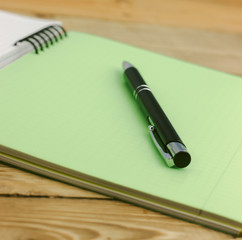 notebook and pen isolated on the white