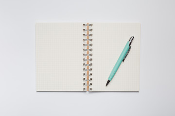 School notebook with stylish green pen