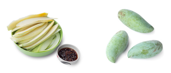 Green mangoes with sweet fish sauce isolated on white