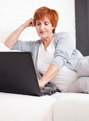 Mature woman with laptop