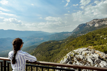 Fototapeta na wymiar tourist looking at view of Mountains, Montenegro