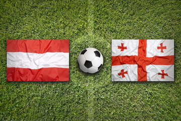 Austria vs. Georgia flags on soccer field