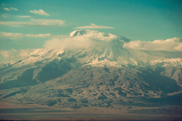 Conquest of peak, achievement concept. Impressive scenic mountain landscape. Big Ararat, Turkey. View point from Yerevan, Armenia. Snow-capped peak. Majestic nature. Copy space. Climbing industry