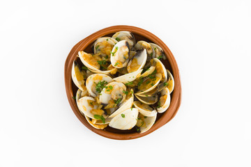 Clams with marinera sauce.Almejas a la marinera. Spanish recipe isolated on white background.Top view