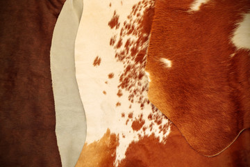Pile of different cow hides