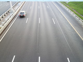 high-speed road at sunset over the sea city	