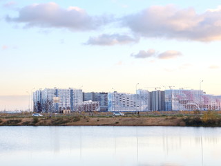 Urban blocks high-rise buildings on the beach at sunset