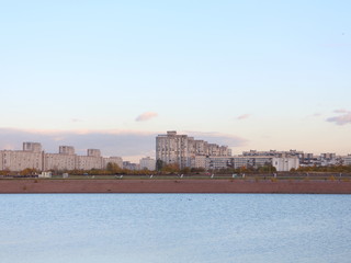 Obraz premium Urban blocks high-rise buildings on the beach at sunset
