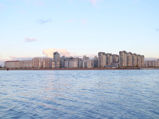 Obraz premium Urban blocks high-rise buildings on the beach at sunset