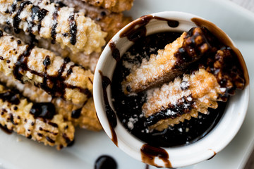 Spanish Dessert Churros with Chocolate Sauce / Baked Sweet Dough.