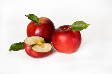 Red, juicy, ripe apples on a white background.