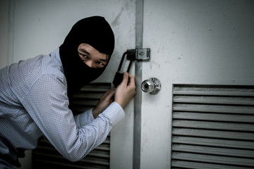 robber in black mask. robbery and crime concept.
