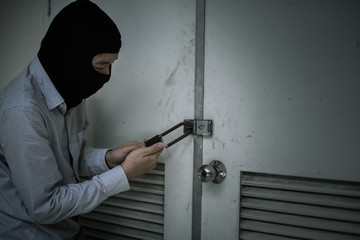 robber in black mask. robbery and crime concept.