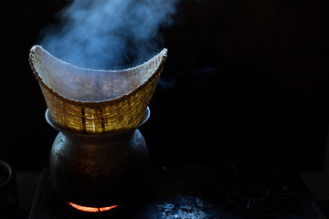 sticky rice made with steam over dark background