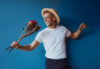 Cheerful hipster with flowers