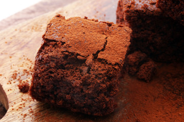 Cake chocolate brownies on wooden background with mint