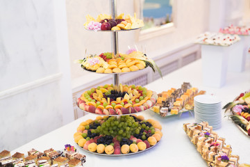 Various sweet sliced fruit on a buffet table