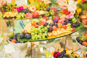 Different fresh fruits on wedding buffet table