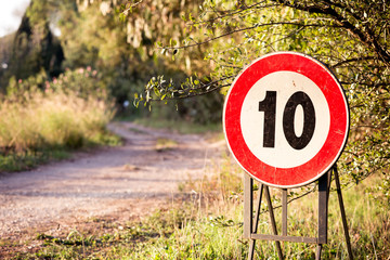 10 speed limit sign in a country road in Italy