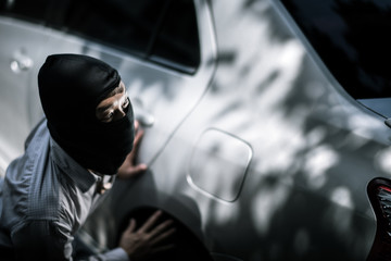 robber in black mask. robbery and crime concept.