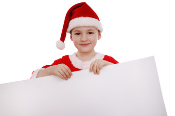 Boy in a suit of Santa Claus holds a white banner label isolated on white background