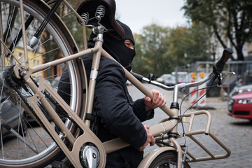 Theft wearing a balaclava stealing a bicycle