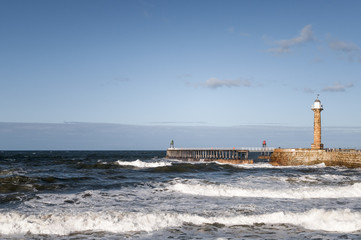 Whitby Harbour West Pier with heavy seas comming in, Yorkshire, England