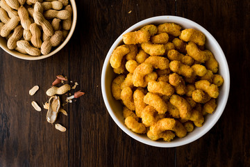 Peanut Chips on dark wooden surface.