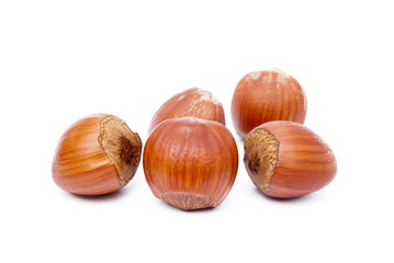 Group healty hazelnuts isolated on white background