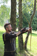 Fototapeta premium Archer arrow bow – Mann Bogen Wald