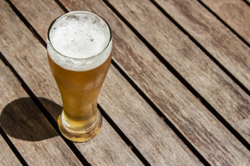 A craft beer (lager) on a wooden table top
